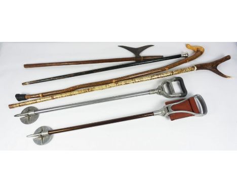 Five Assorted Walking Sticks / Shooting Sticks, To include a Silver Top and Antler Handled Walking Stick, With an Indian Batt