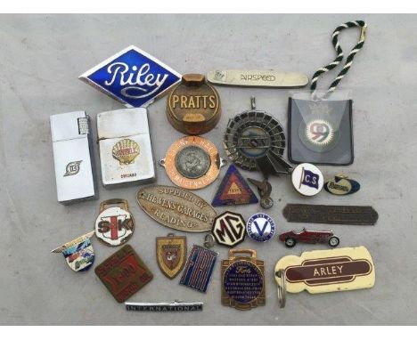A quantity of assorted motoring collectables and enamel badges to include a Shell lighter, a part enamel St. Christopher supp