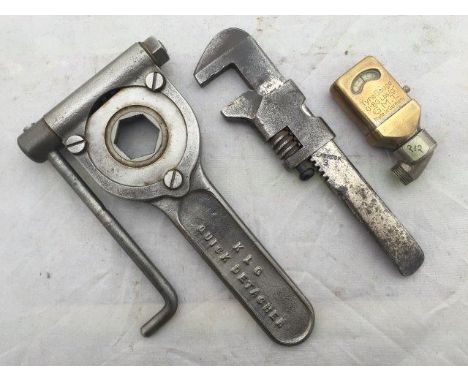 A rare KLG 'quick detacher', a 'Seabrook 3' adjustable spanner and a General Motor and Tyre Company tyre gauge, GMT made in G