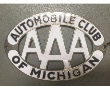 An Automobile Club of Michigan oval part enamel car badge. 
