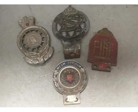Four assorted car badges to include one with Wolverhampton part enamel centre. 