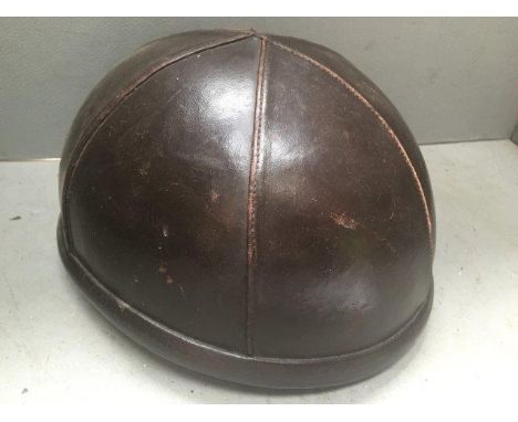 An early leather covered 'pudding basin' helmet, Modele YC.
