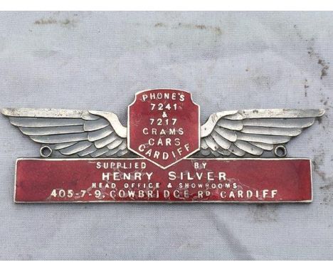 An enamel supplier's dash plaque for Grams Cars of Cardiff, supplied by Henry Silver.