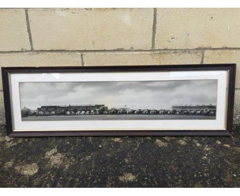 A framed and glazed early black and white scene of a garage selling Vauxhall cars and Bedford Trucks, 34 1/2 x 10 3/4"