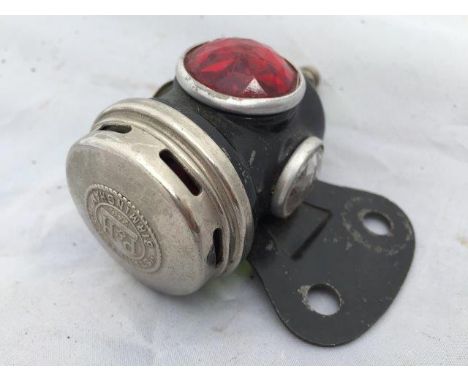 A new old stock Powell & Hanmer 'Starlight' motorcycle tail lamp.