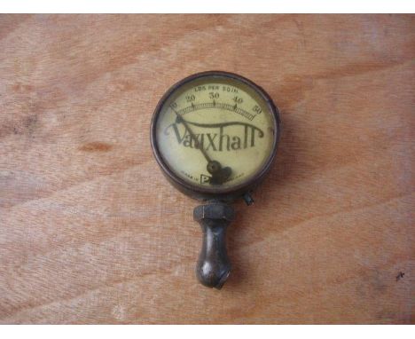 A Vauxhall 30-98 tyre pressure gauge.
