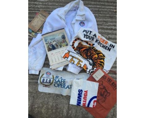 A box of assorted items relating to Esso promotions including a jacket, a tea towel etc. 