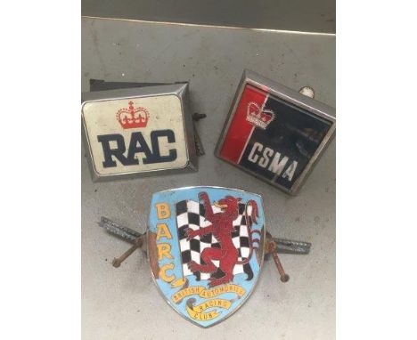 A BARC enamel car badge and two others.