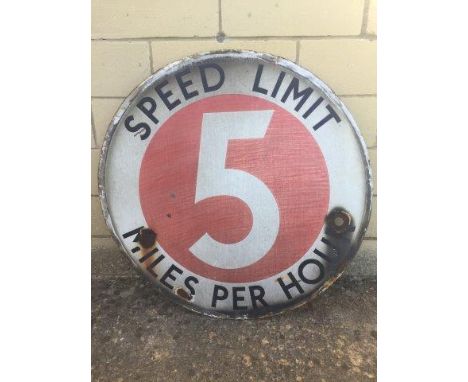 An early circular enamel sign - Speed Limit Five Miles per Hour, set withn an original wrought iron frame, 31 3/4" diameter.