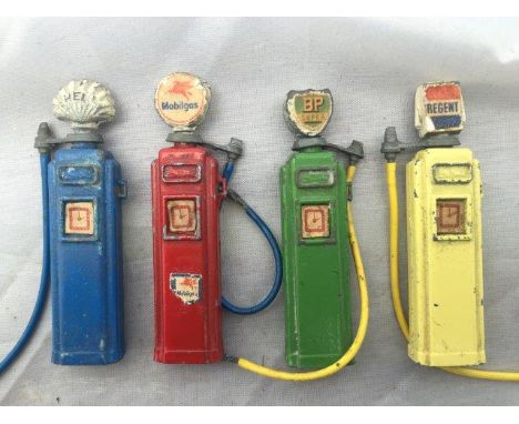 A set of four miniature diecast petrol pumps with globes and original labels for Regent, Shell, BP Super and Mobilgas.