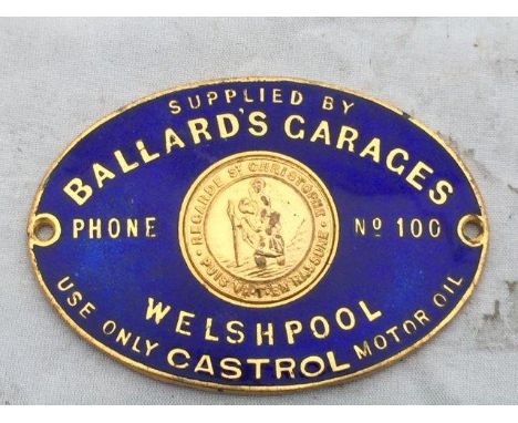 An oval enamel Supplier's dash plaque for Ballard's Garages, Welshpool.