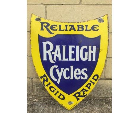 An early Raleigh Cycles shield shaped double sided enamel sign by Sells Limited London, in good condition, 18 1/2 x 24" appro
