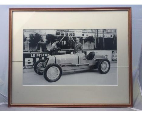 Philippe Etancelin - a framed and glazed print depicting the driver beside a Maserati at the 1934 Monacco Grand Prix, 20 3/4 
