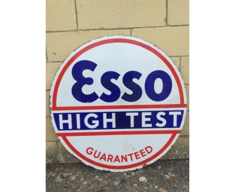 A large Esso Hi-Test Guaranteed circular double sided enamel sign, dated January 1935, with some retouching, 30" diameter.