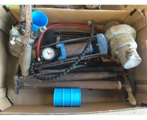 A box of assorted items including footpumps, an early forecourt light etc. 