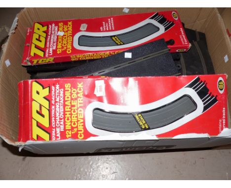 A large selection of plastic racing track; a quantity of army men and accessories