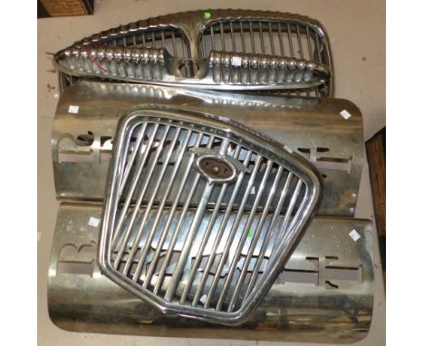 Two vintage chrome car radiator grills; a similar mount; 2 stainless steel Renault mounts