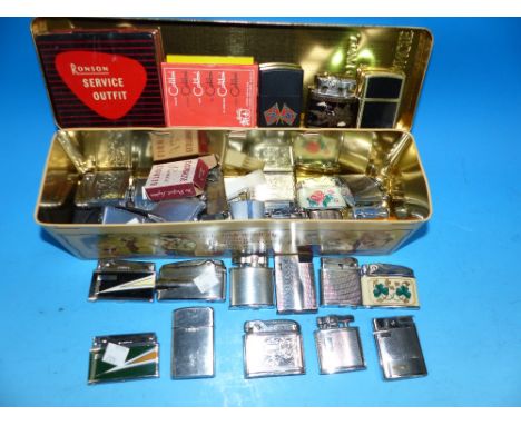 A collection of 32 vintage/novelty cigarette lighters