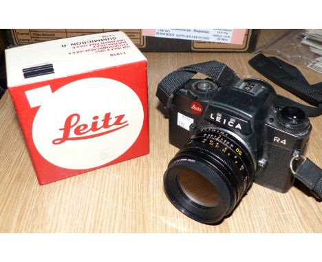 A Leica R4 with Summicron - R f2 50 mm lens fitted Elpro 2 converter