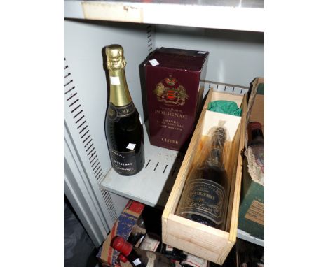 A bottle of Lenoble champagne, boxed; another bottle; a bottle of cognac