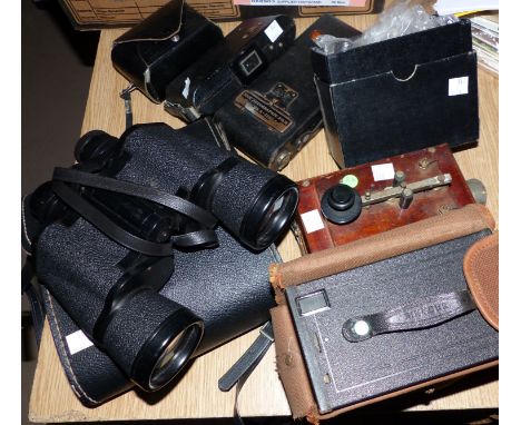 Three mid 20th century vintage cameras; a pair of binoculars; a morse code tapper; a vintage travelling iron