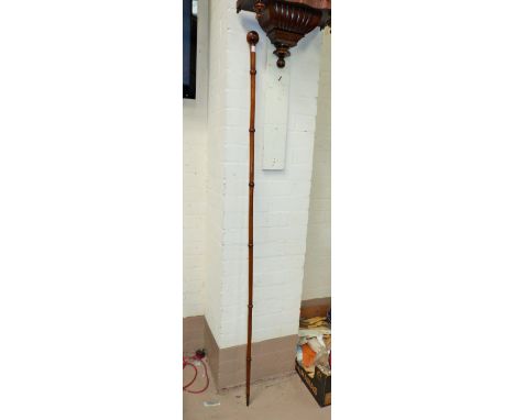 A Drum Major stye long swagger stick with knopped terminal and brass top, length 68"