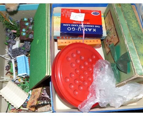 A selection of doll's garden furniture; vintage games