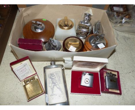 Four Ronson cigarette lighters, boxed; a Consul cigarette lighter; 7 table lighters and a golfing hip flask