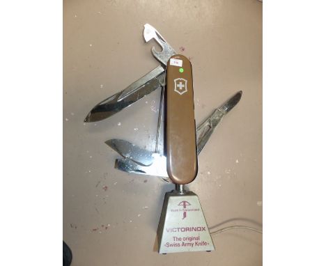 A "Victorinox" Swiss Army Knife illuminated shop display