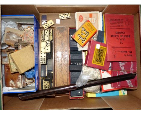 A 19th century inlaid game board and a selection of vintage toys