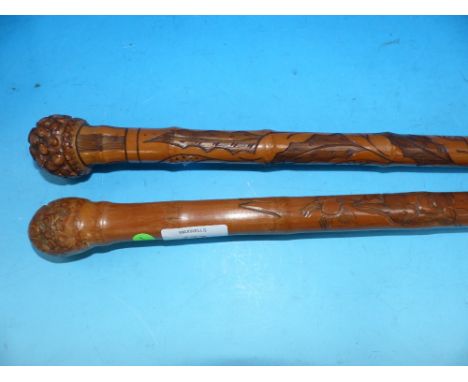 A Japanese bamboo walking stick carved with a python, signed; and another