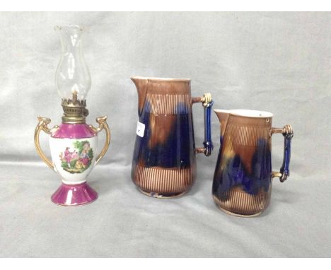 TWO DOULTON LAMBETH STYLE JUGS AND A CONTINENTAL SMALL LAMP 