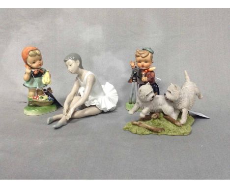 TWO NAO FIGURESalong with two German figures, a hand-made Scottish figure grouping of a pair of dogs, and a green glazed vase