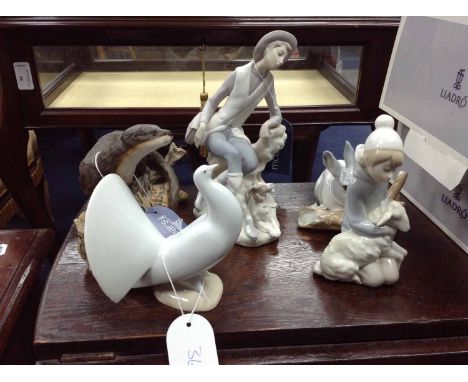 LOT OF LLADRO FIGURESincluding a rabbit, dove, boy with dog, girl with lamb, and two boxed figures; together with a Border Fi