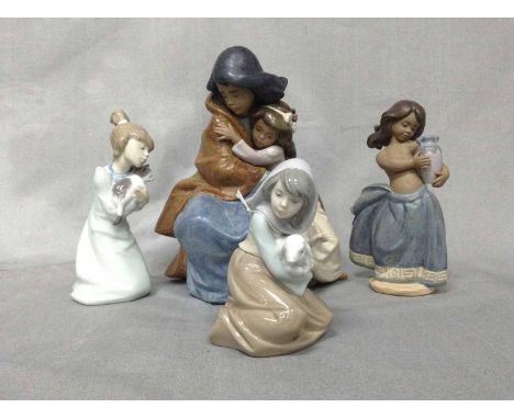 FOUR LLADRO FIGURESincluding a group depicting two girls embracing, 24cm high 