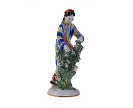  A Porcelain Figurine of an Uzbek Girl Cotton Picker  SOFIA VELIKHOVA, PAINTING BY LARISA GRIGORIEVA, LOMONOSOV STATE PORCELA