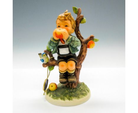 Hand painted child figural sitting in tree enjoying an apple. Hummel Goebel tag - Temporarily Withdrawn. Goebel backstamp. Is