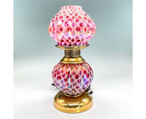 Striking clear and opaque glass lamp with brass fixtures. The top and bottom are separate pieces. Signed Fenton and numbered 