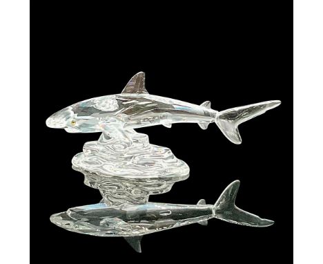 Part of the 'South Sea' theme. Clear faceted body with yellow-green eyes. The shark is swimming over a clear base. Swarovski 