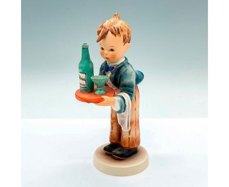 Hand painted figure of a young server holding a tray of wine. Goebel Hummel backstamp. Issued: c. 1979-1990Dimensions: 3.75"L