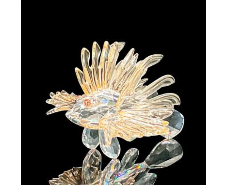Part of the 'South Sea' theme. Clear faceted fish with very light orange fins, and salmon-color eyes. Swarovski marking. This