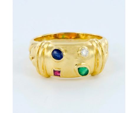 Gorgeous contemporary ladies 18K yellow gold ring featuring diamond, ruby, sapphire and emerald. Weight 7.7 grams. Size 8.5. 