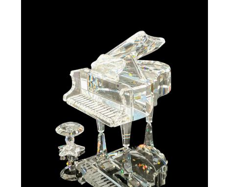 Sparkling faceted crystal figurine modeled as a grand piano with tiny stool. Swarovski acid marks. This item has its original