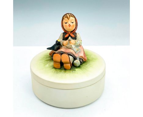 Candy box with a girl singing with a bird and knitting in a field. Goebel backstamp, and III/69 item number imprint. Issued: 