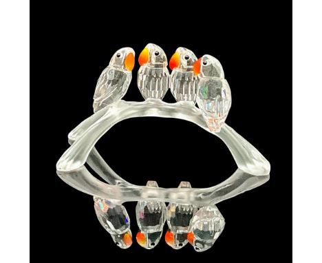 Part of the 'Feathered Beauties' theme. Four clear faceted crystal birds perched on a frosted arched branch. Fire opal crysta