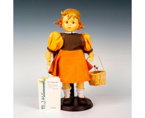 Hand painted in matte finish modeled as a German girl on her way to school. Doll stands on her display stand and carries a ba
