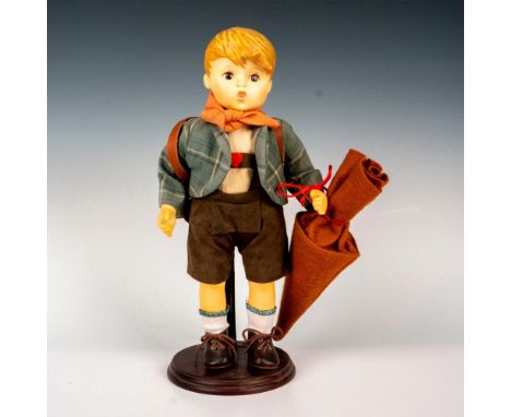 Hand painted in matte finish, modeled as a German boy on his way to school. Goebel backstamp. Dimensions: 7.25"L x 5.25"W x 1