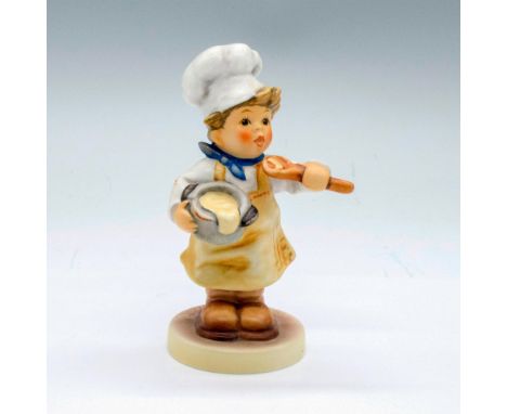 Porcelain figure or a young boy in a chef's hat and apron holding a bowl of batter and wooden spoon. First Issue Millennium. 