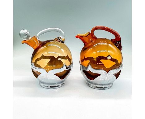 Krome Kraft amber glass in silver plated frame holders. Decanter with clear handle and stopper 7.5"H x 5"W. Pitcher in darker