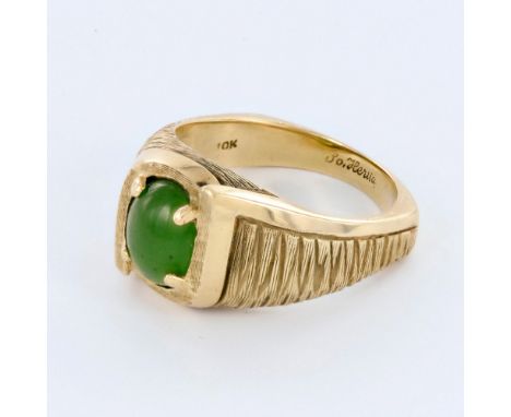 Beautiful vintage Art Deco style ring in 10K yellow gold with an oval green jade in the center. Weight 8.7 grams. Size 10.5. 